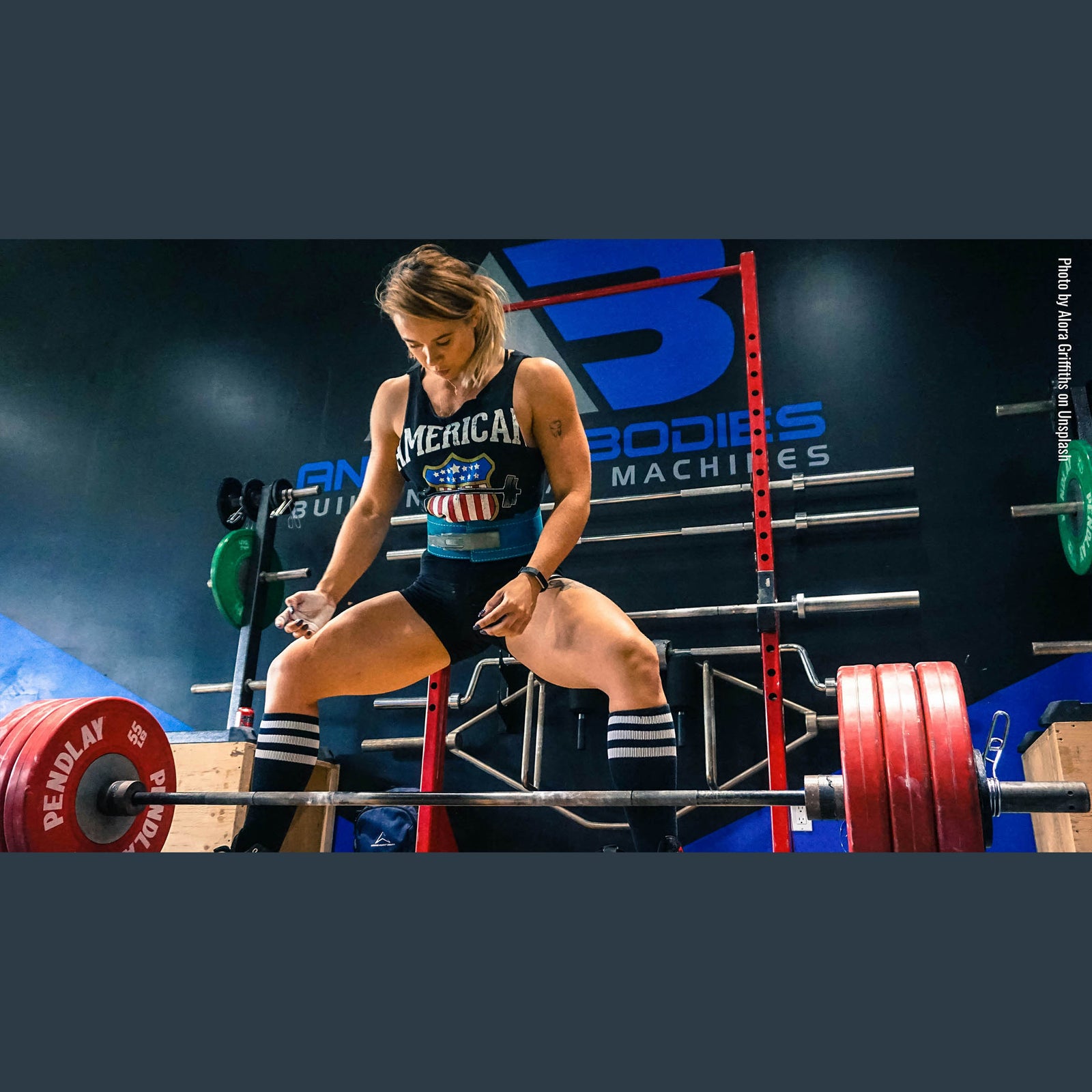 Female competitor preparing to lift barbell