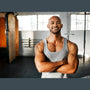 Muscular black male athlete stands proud of his accomplishments